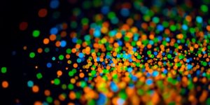 Colorful data points on a dark background.
